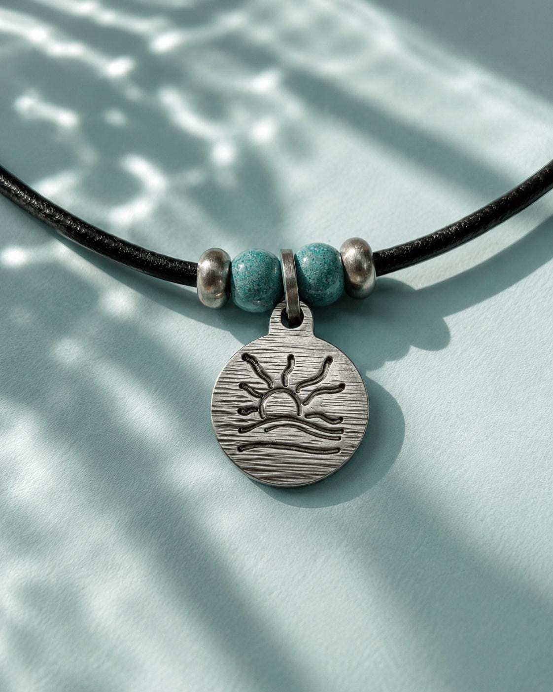 Turquoise Bead Hatched Naturist Symbol Leather Necklace