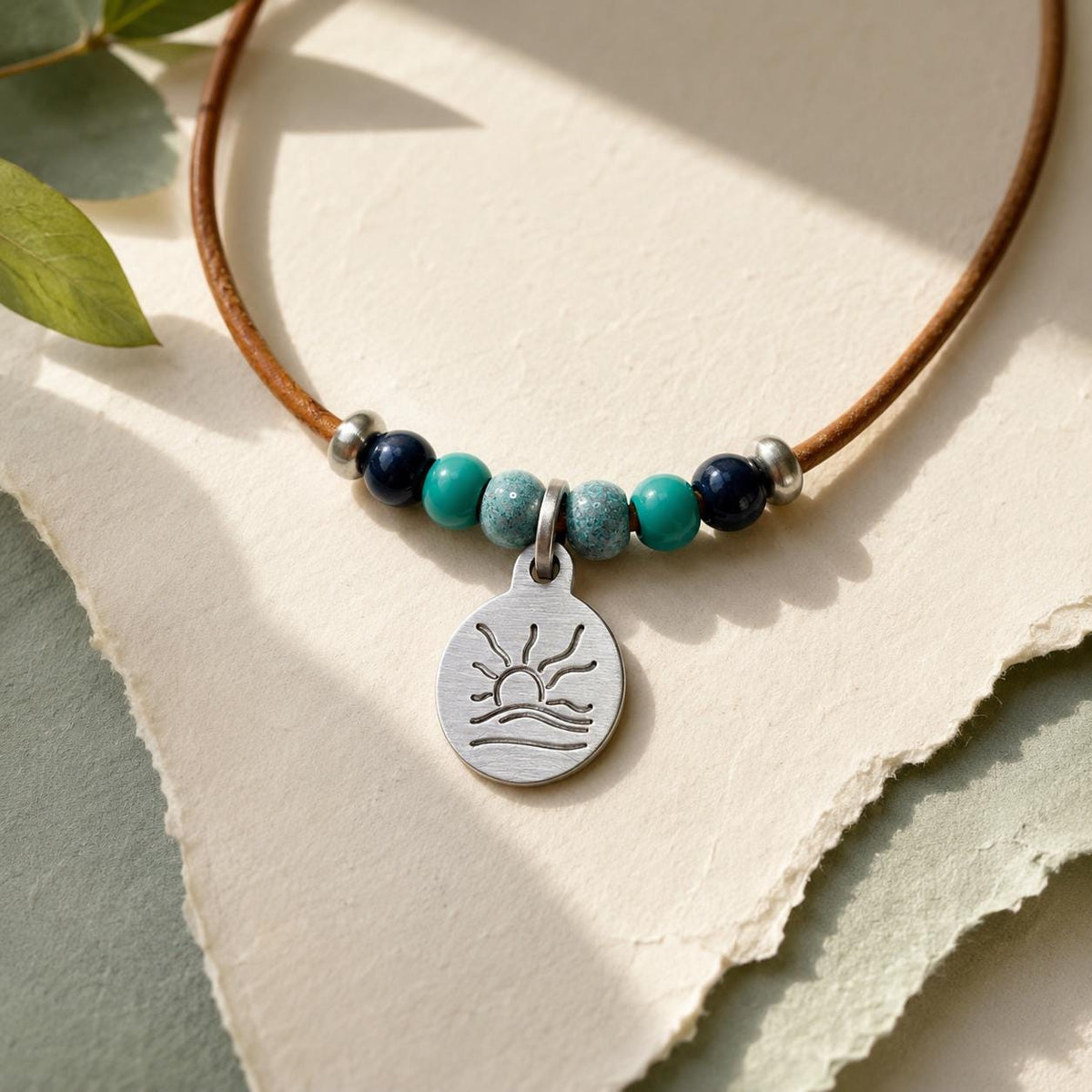 Blue and Teal Bead Naturist Symbol Leather Necklace