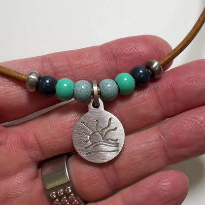 Blue and Teal Bead Naturist Symbol Leather Necklace